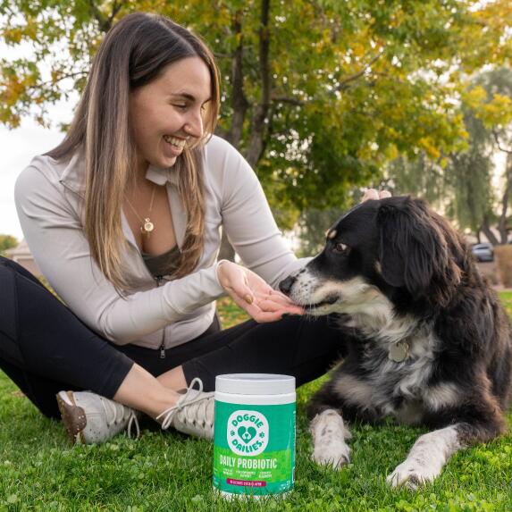 woman kissing dog