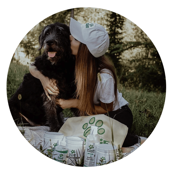 woman kissing dog