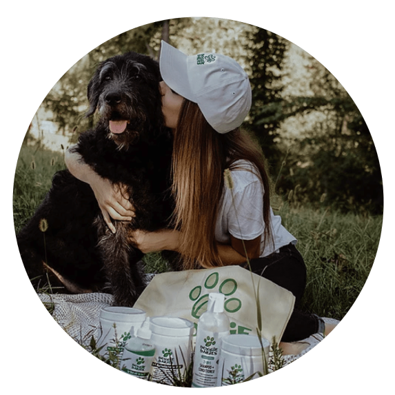 woman kissing dog