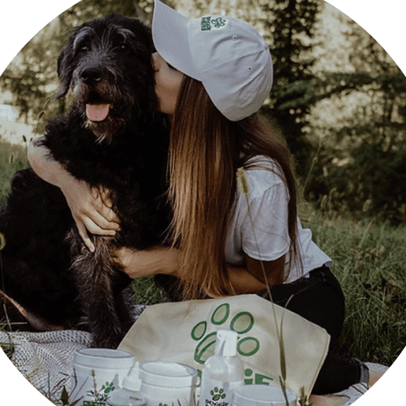 woman kissing dog